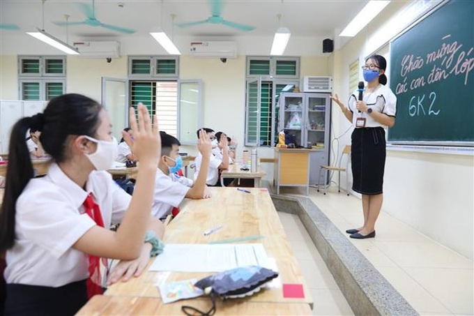 Việc trở lại trường của học sinh phải theo cấp độ dịch của địa phương. Ảnh: TTXVN