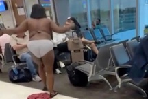 Cô gái cởi hết quần áo ném trả cho bạn trai, gây náo loạn sân bay
