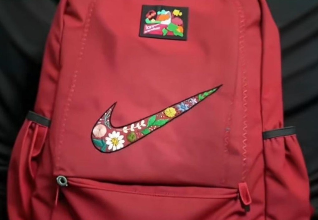 Nữ thợ may thêu “chui” logo hàng hiệu bỗng gây sốt, hãng tìm đến tặng quà - 1