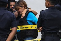 Đoàn Thị Hương mặc áo chống đạn khi tới tòa