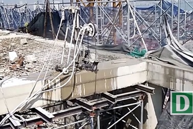 Dùng máy cắt dây kim cương "cắt ngọn" tòa nhà 8B Lê Trực