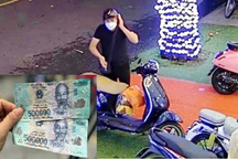 Ăn mặc sang trọng để tiêu thụ tiền giả loại 500.000 đồng