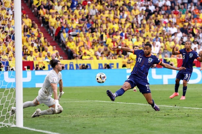 munich-germany-cody-gakpo-of-the-netherlands-scores-a-goal-as-florin-nita-of-romania-fails-to-crop.jpeg