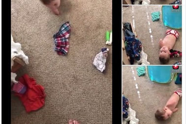 Tan chảy trước hình ảnh nhóc không tay không chân tự thu gọn quần áo