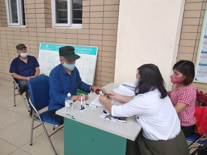 Hà Nội: Hỗ trợ hơn 514 nghìn người bị ảnh hưởng bởi dịch Covid-19 - Ảnh 1. Hà Nội: Hỗ trợ hơn 514 nghìn người bị ảnh hưởng bởi dịch Covid-19 - Ảnh 1.