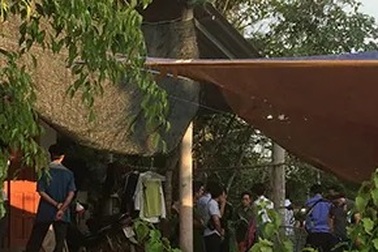 Sau tiếng súng, một phụ nữ bị trọng thương trong nhà