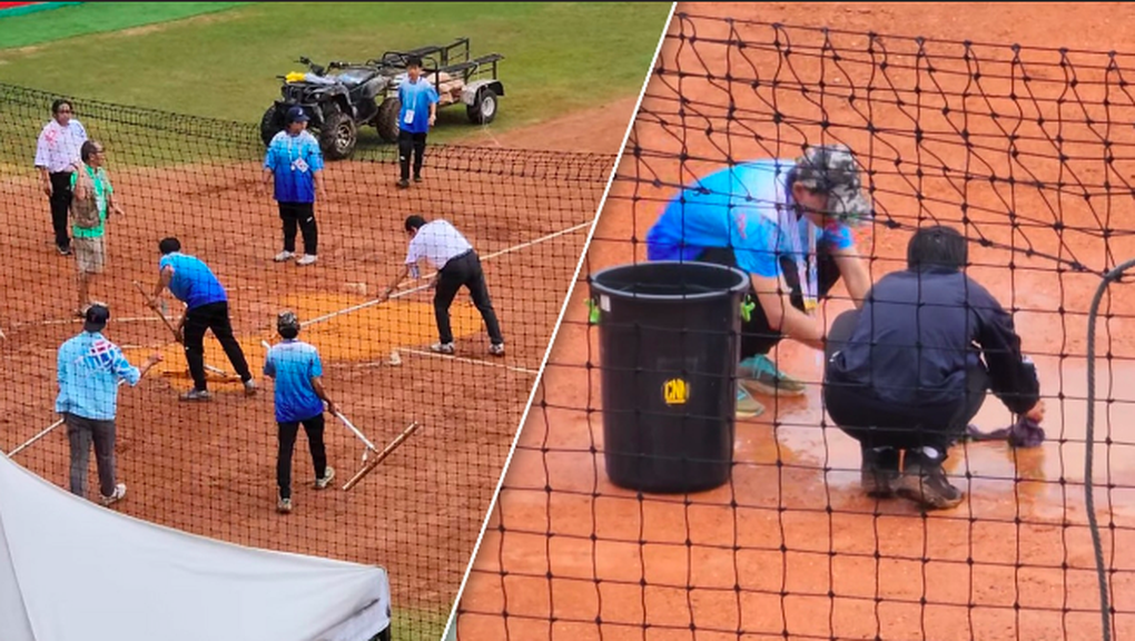 Hình ảnh gây sốc ở SEA Games: Dùng cách thủ công hút nước trên sân - 1