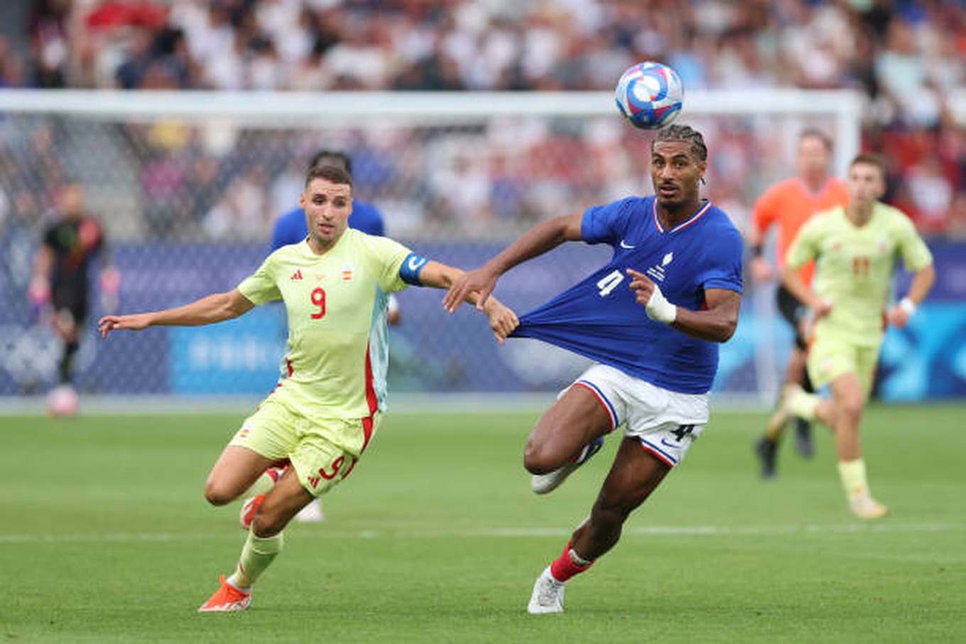 paris-france-loic-bade-of-team-france-and-abel-ruiz-of-team-spain-battle-for-the-ball-during.jpg