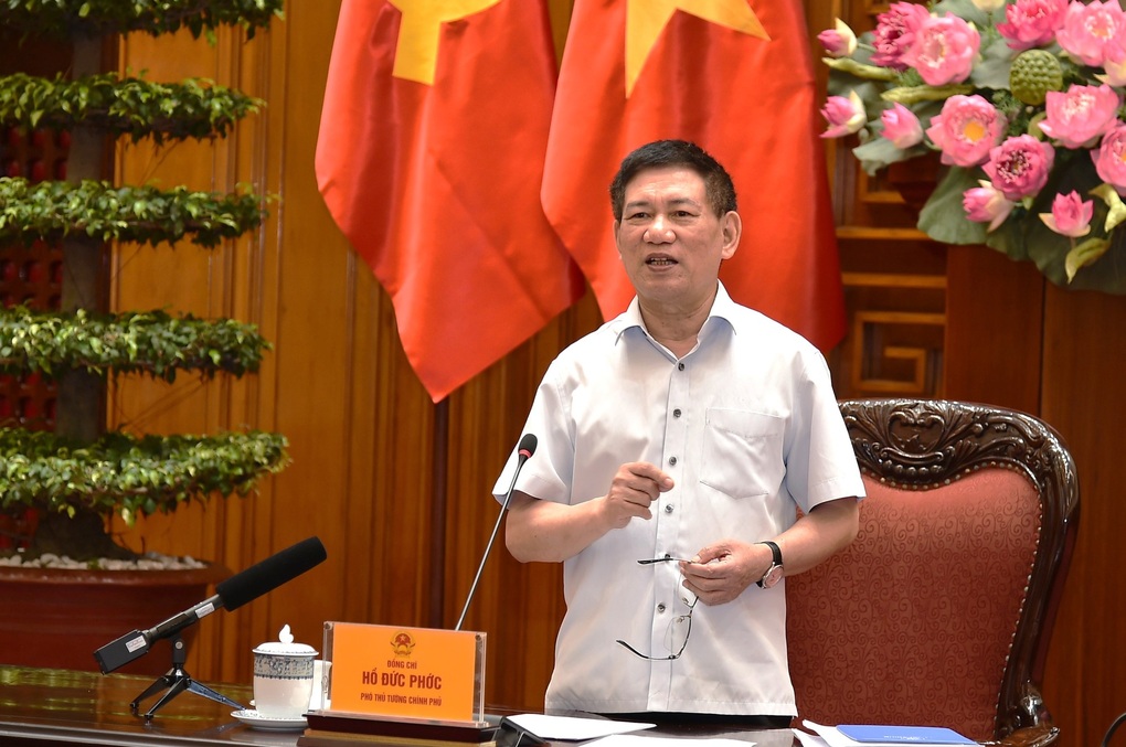 副首相、不動産税および株式譲渡税の算定について企業と会談 - 1 Phó Thủ tướng họp với doanh nghiệp về tính thuế chuyển nhượng BĐS, cổ phiếu - 1