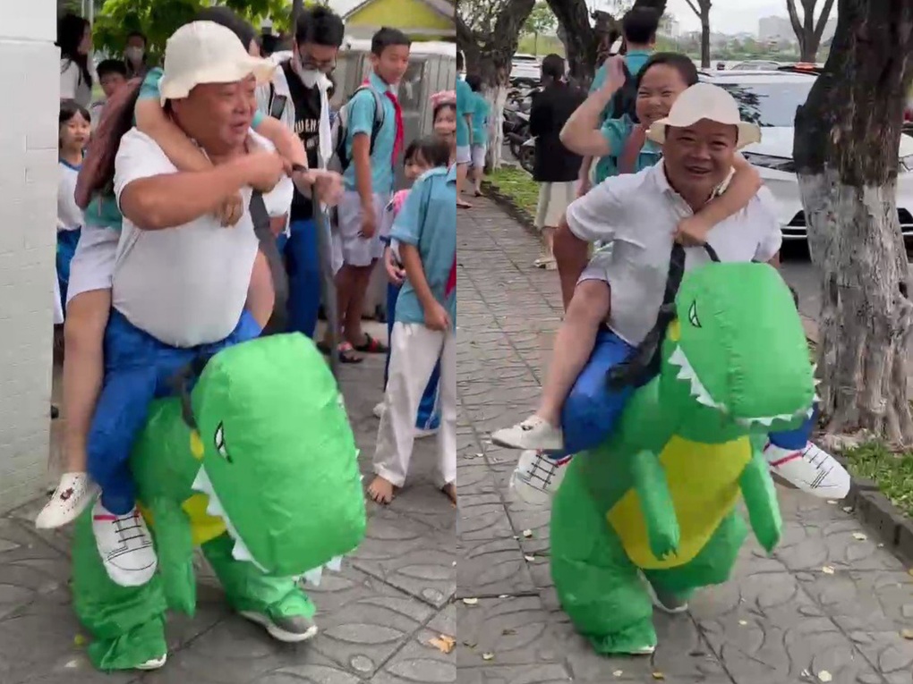 Đà Nẵng: Cha mặc đồ khủng long đón con gái ở trường gây sốt mạng xã hội - 1 Đà Nẵng: Cha mặc đồ khủng long đón con gái ở trường gây sốt mạng xã hội - 1