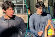 Thầy giáo dạy bơi khốn khổ vì... quá hấp dẫn