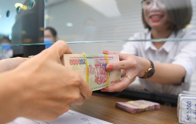 Lãi suất ngân hàng giảm. Ảnh minh họa