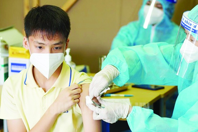 Tiêm vaccine phòng Covid-19 là một biện pháp hiệu quả để giúp trẻ tránh bị mắc bệnh Covid-19.
Ảnh minh họa KT