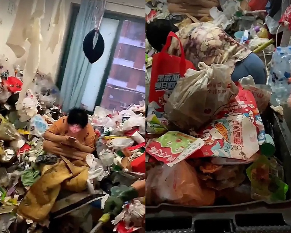 Cô gái thản nhiên chơi điện thoại ở phòng trọ hôi thối, rác chất thành núi - 1 Cô gái thản nhiên chơi điện thoại ở phòng trọ hôi thối, rác chất thành núi - 1