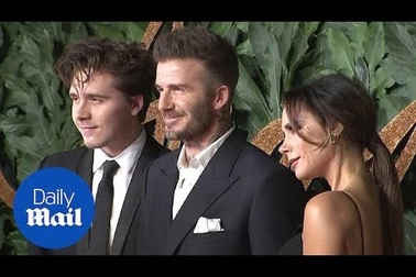 Vợ chồng Beckhams đưa con dự sự kiện