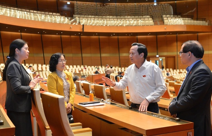 Chiều nay, Quốc hội thảo luận dự Luật Người lao động Việt Nam đi làm việc ở nước ngoài theo hợp đồng - Ảnh 1. Chiều nay, Quốc hội thảo luận dự Luật Người lao động Việt Nam đi làm việc ở nước ngoài theo hợp đồng - Ảnh 1.