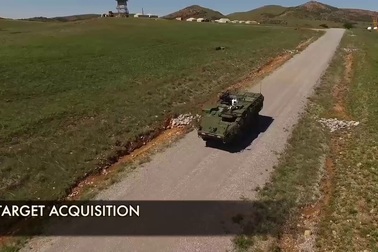 Xem vũ khí laser trên xe Stryker đốt cháy mục tiêu