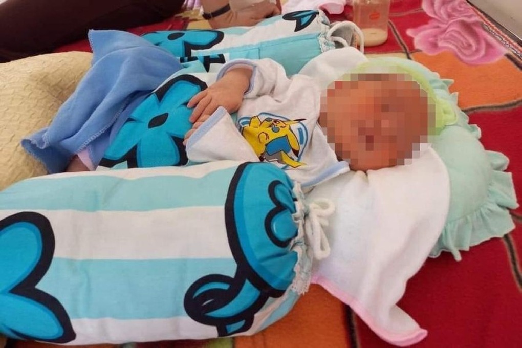 Bé gái sơ sinh bị bỏ lại cổng đền lúc rạng sáng cùng một triệu đồng - 1