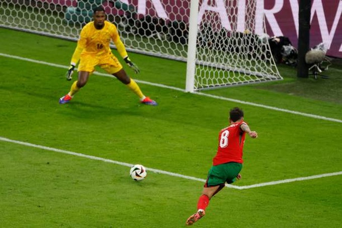 portugals-midfielder-bruno-fernandes-kicks-the-ball-during-the-uefa-euro-2024-quarter-final.jpg