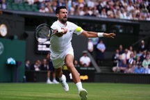 Djokovic cán mốc 100 chiến thắng ở Wimbledon