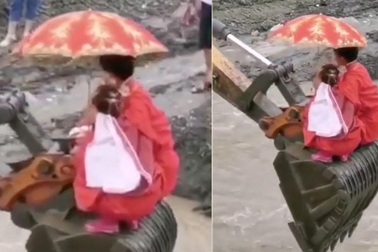 Lũ cuốn trôi cầu, cô dâu chú rể vượt sông bằng... máy xúc