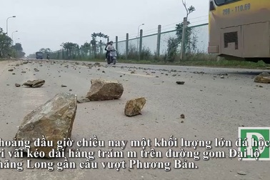 Đá hộc rơi vãi đầy đường Đại lộ Thăng Long