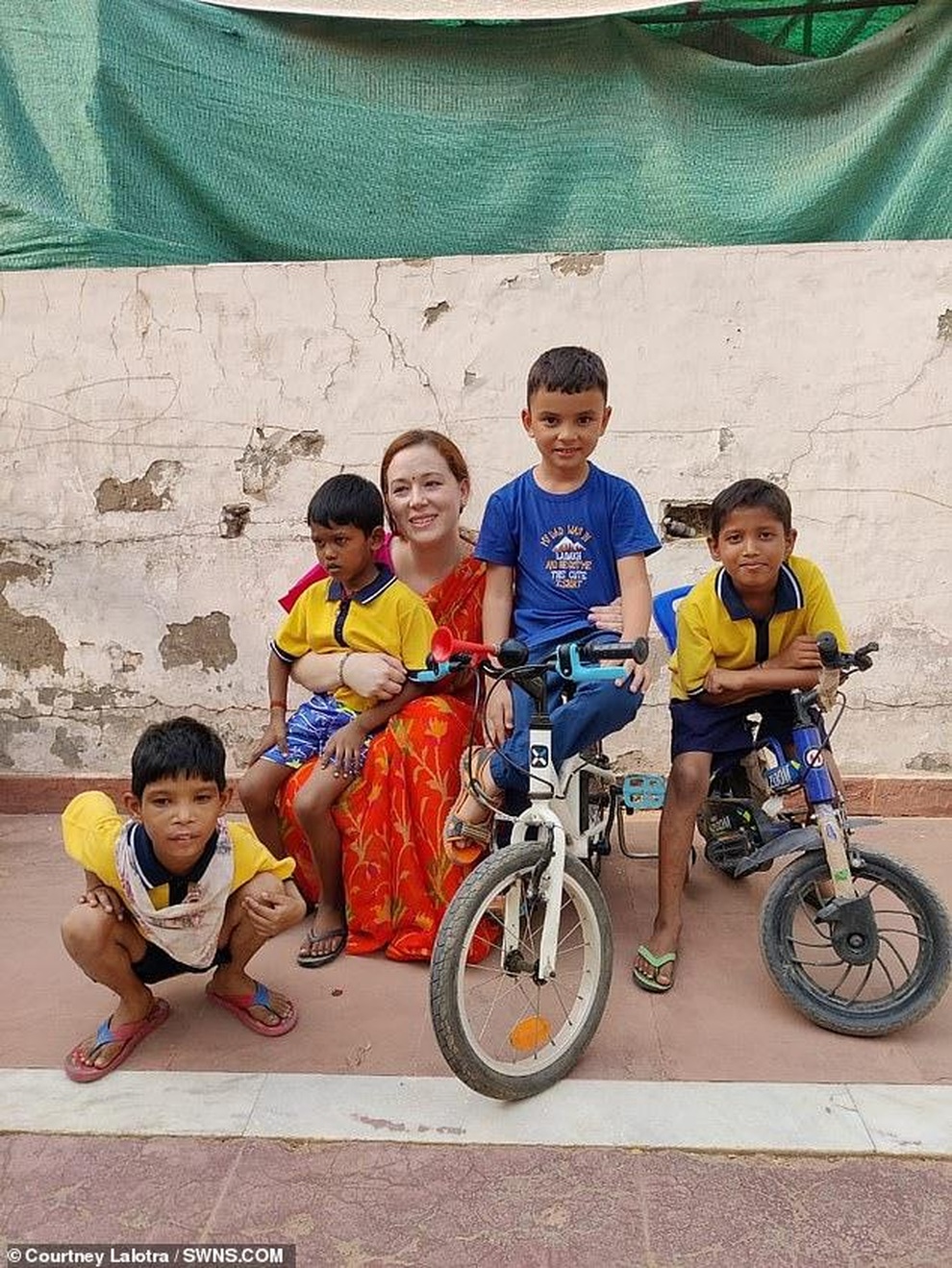 Người phụ nữ bán hết tài sản… nhận nuôi 11 đứa trẻ cơ nhỡ - 8