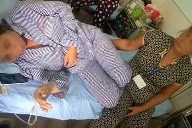 Vợ tố bị chồng đổ thuốc diệt chuột vào miệng