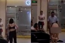 Bị chồng cũ đòi lại áo quần đã tặng, cô gái thoát y ngay nơi công cộng