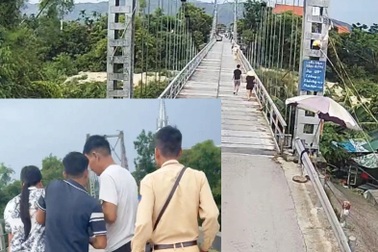 Cảnh sát trèo lan can ngăn người phụ nữ định nhảy cầu tự vẫn