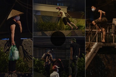 Người dân vượt rào thép gai vận chuyển đồ, rời khỏi khu phong tỏa