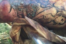 Truy tìm danh tính thi thể trôi sông có hình xăm nàng tiên cá