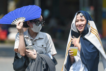 Miền Bắc oi nóng, mưa dông trở lại cuối tuần