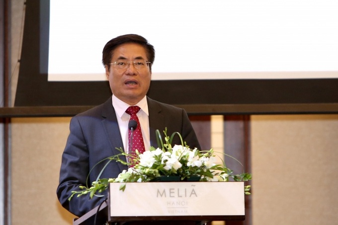 Cục trưởng Cục Quản lý nợ và tài chính đối ngoại Trương Hùng Long phát biểu tại hội thảo.