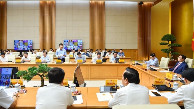 Thứ trưởng Thường trực Bộ Ngoại giao Nguyễn Minh Vũ báo cáo tại Hội nghị.