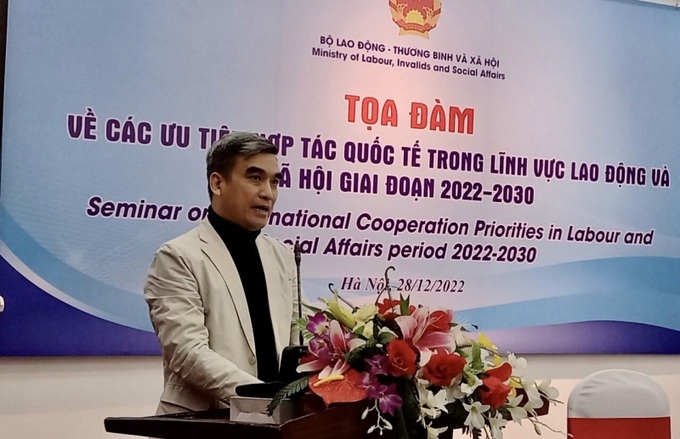 Ông Lưu Quang Tuấn, Vụ trưởng Vụ Hợp tác quốc tế, Bộ LĐ-TB&XH phát biểu tại tọa đàm.