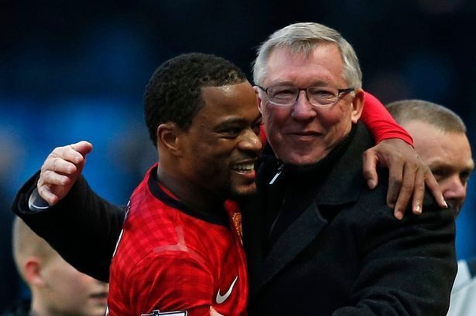 Manchester-United-manager-Ferguson-congratulates-Evra-after-winning-their-English-Premier-League-soc.jpg