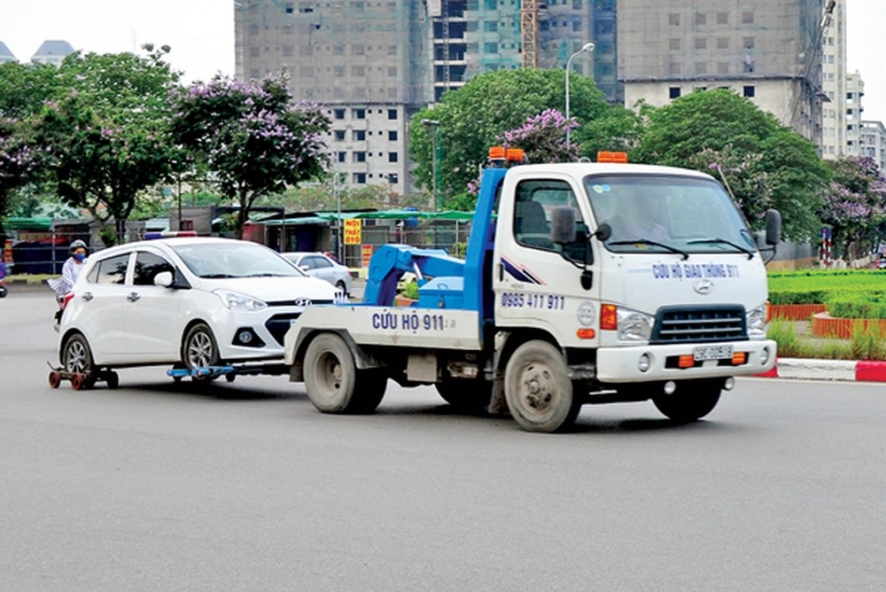 Chủ phương tiện vi phạm có được mặc cả phí cẩu, kéo xe không? - 3