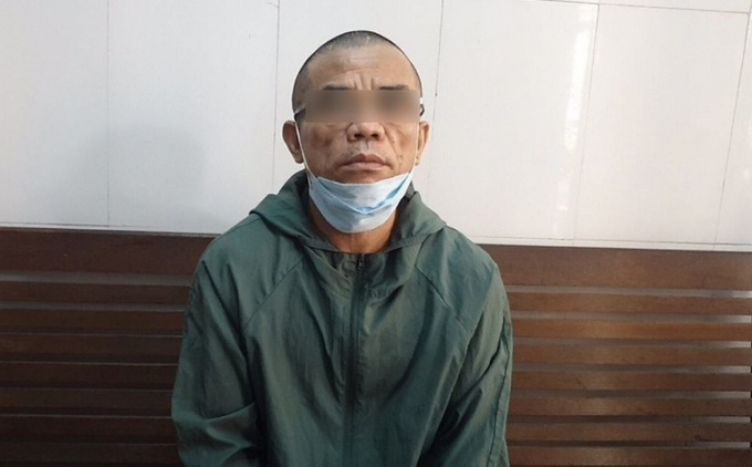 Đối tượng Phan Trọng Sơn tại cơ quan điều tra (Ảnh NM).