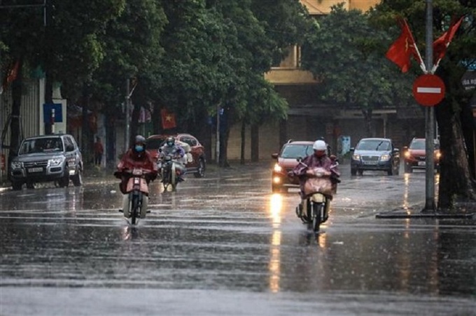 Hà Nội có mưa, thời tiết dịu mát.