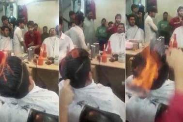 Thợ tóc nổi tiếng thế giới nhờ châm lửa trên đầu khách